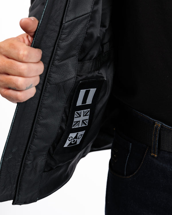 Close-up of a black jacket with a brand logo on a white background