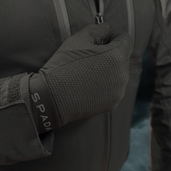biker wearing black base layer gloves