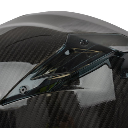 Carbon fiber motorcycle windshield with a glossy finish on a white background