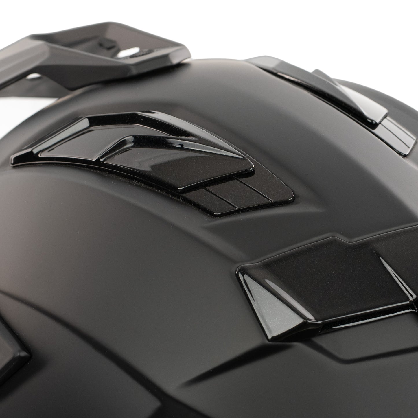 Close-up of a black motorcycle helmet with reflective visor