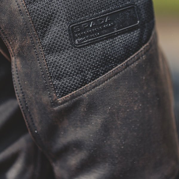 Close-up of jacket sleeve detailing, highlighting vented panels and heavy-duty stitching