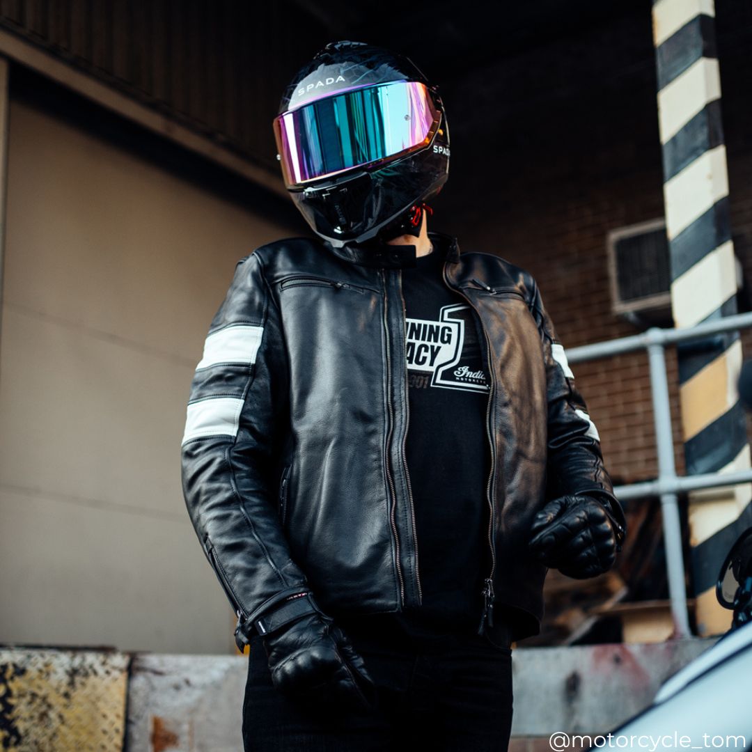 biker wearing black leather motorcycle jacket for men with black helmet with multicoloured visor