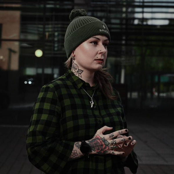 female biker wearing bobble beanie in the winter