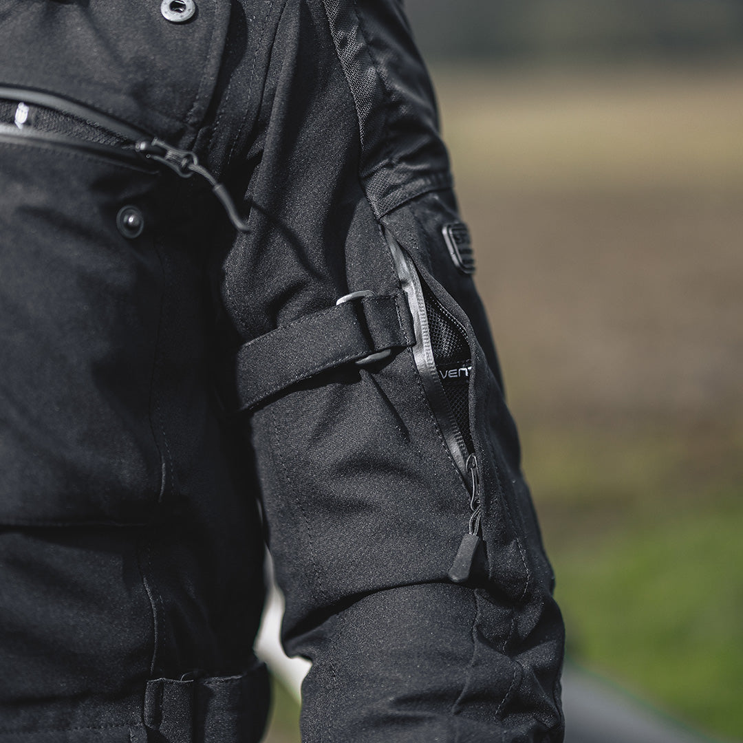 closeup of arm of black jacket with air vents on sleeve