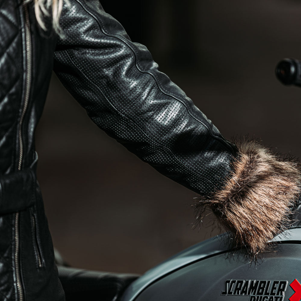 close up of arm details of black motorbike jacket for women with faux fur cuff and ventilation