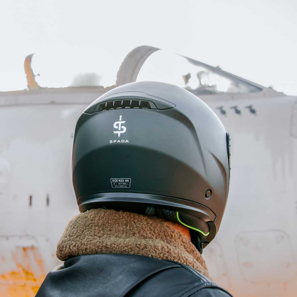 back of biker wearing black matte motorcycle helmet