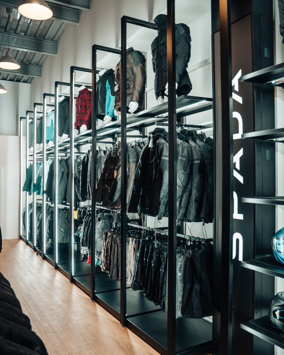 inside the Spada loft clothing store with spada branding and motorcycle jackets in store