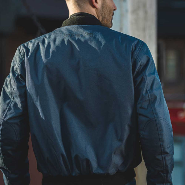 back of biker wearing navy blue motorcycle jacket for men