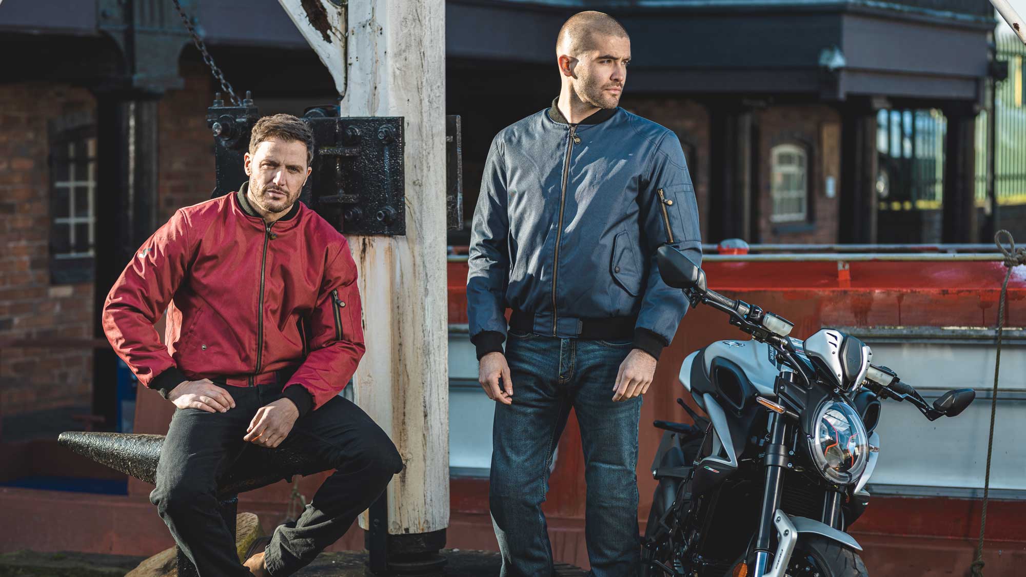 bikers wearing red and navy blue bomber motorcycle jackets for men with motorbike