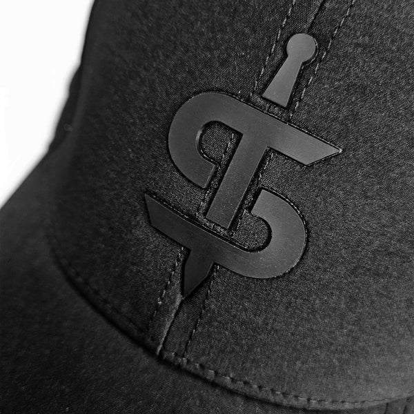 closeup of black spada logo on black spada cap