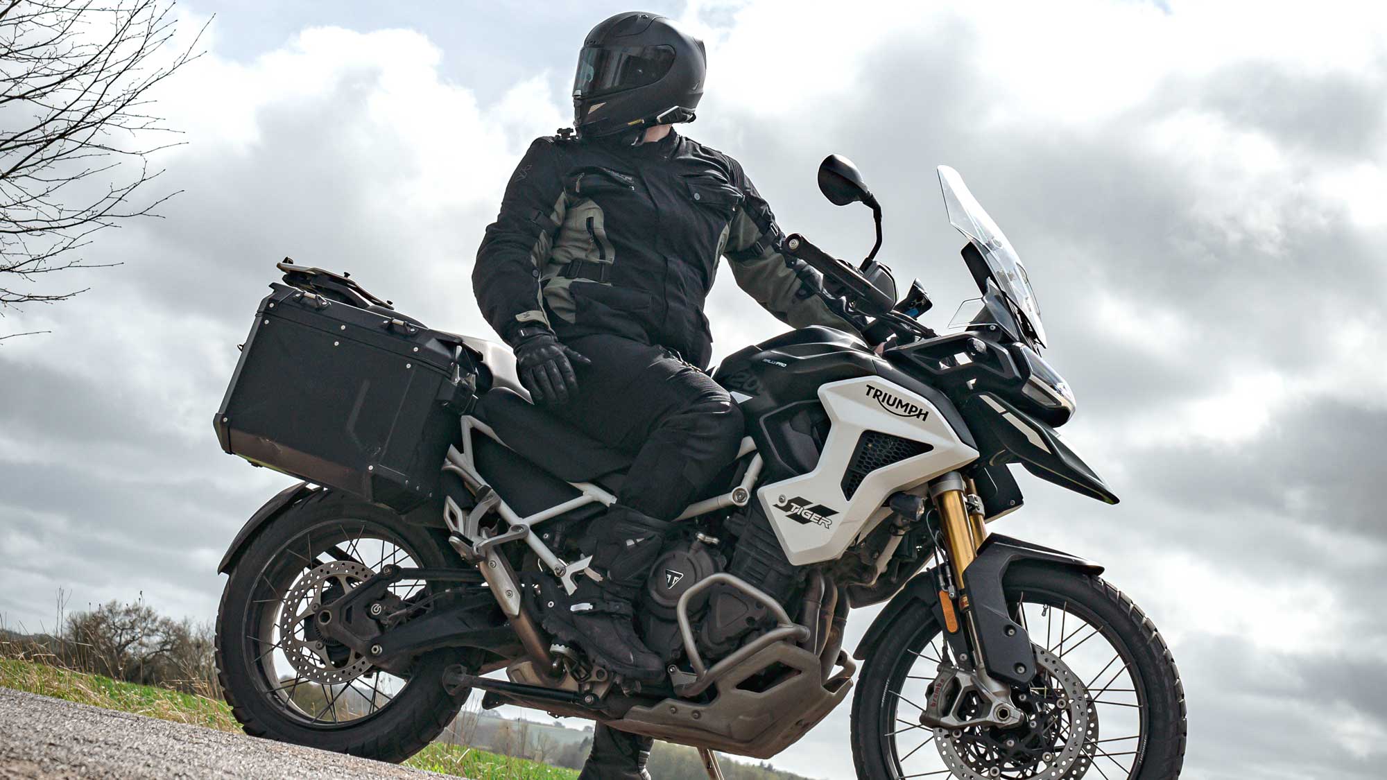 biker wearing black and green motorcycle jacket for men on motorbike