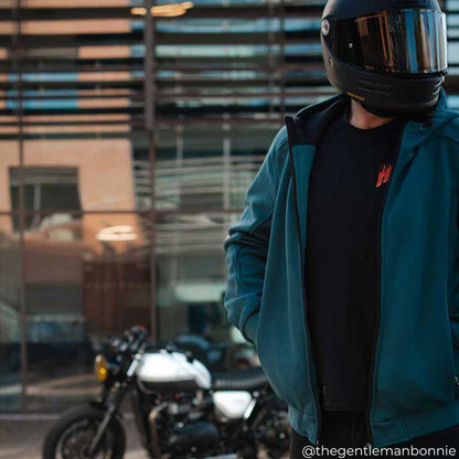 closeup of blue open zip motorcycle hoodie on biker with black helmet and motorbike