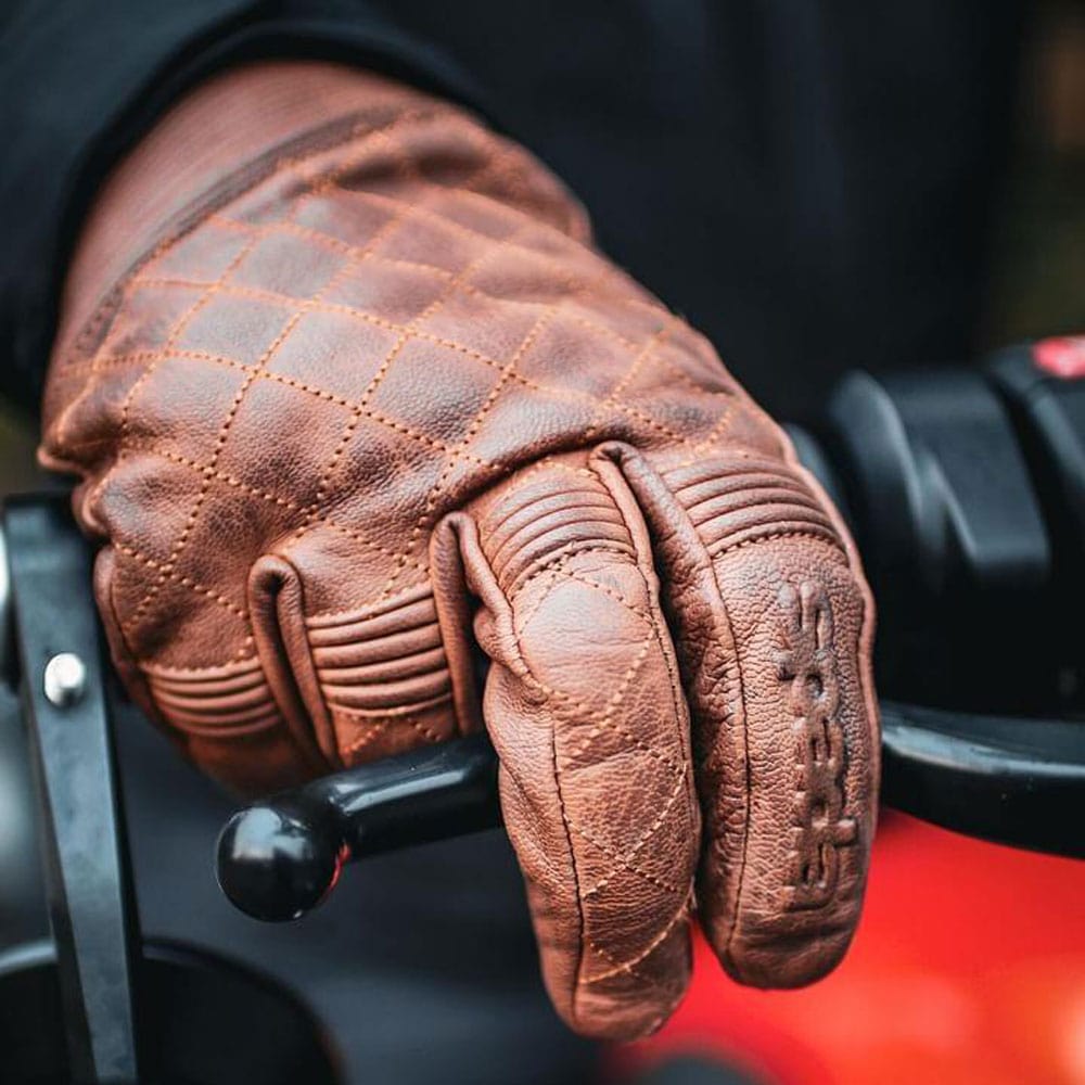 motorbike rider wearing brown leather spada gloves while riding