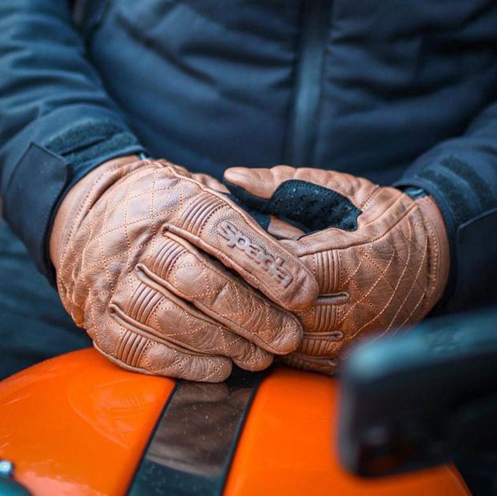 close up of brown leather motorcycle gloves for riding with detail to stitching