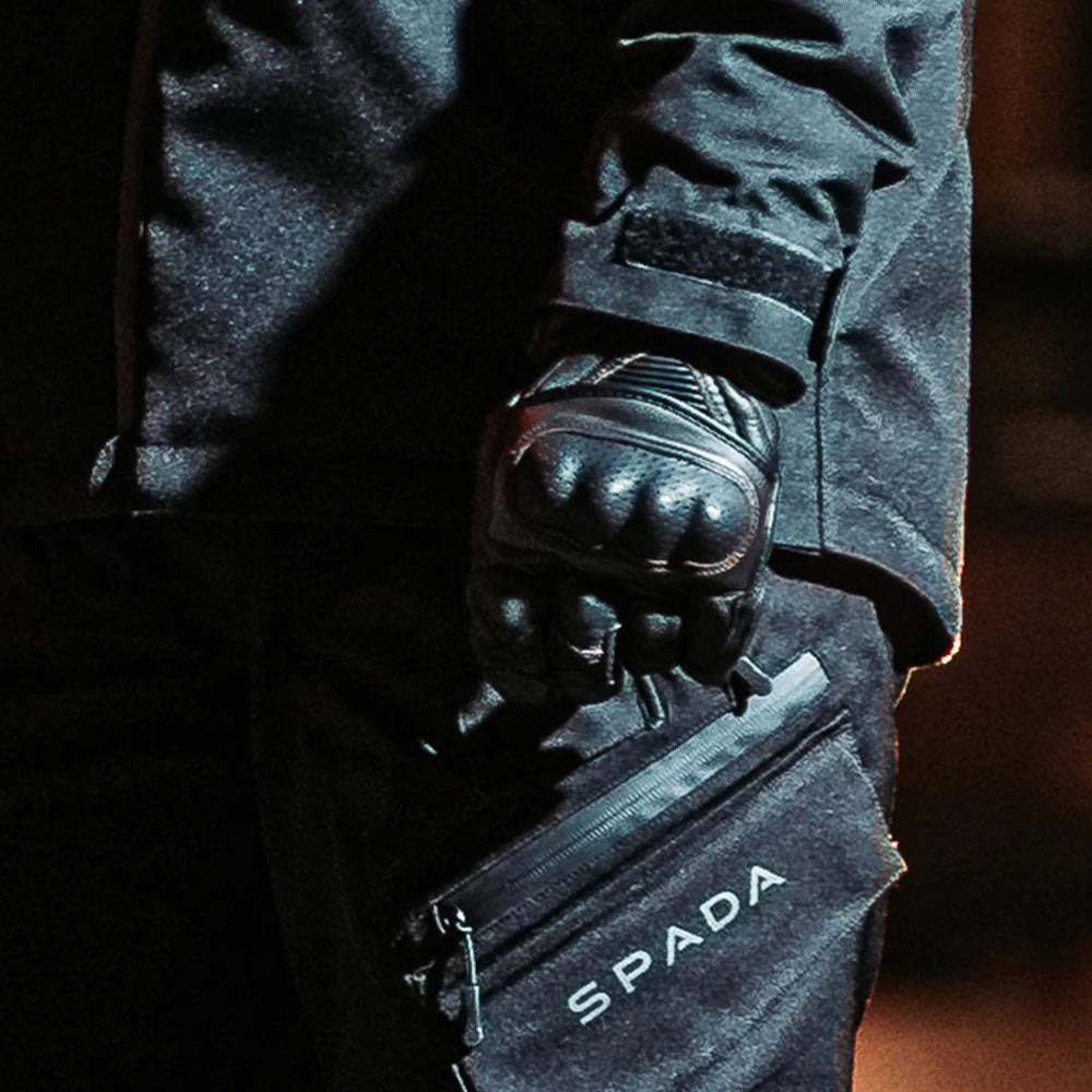 biker wearing spada black leather motorcycle gloves with pre curled finegrs