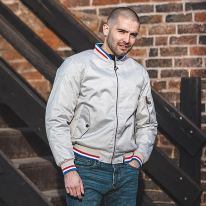 motorcyclist wearing cream bomber jacket with ce protection for riding