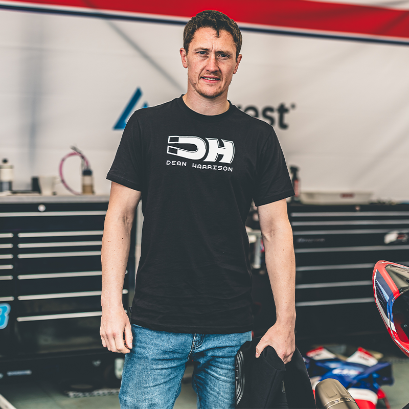 dean harrison wearing black tshirt from his merch range with the dean harrison logo in white