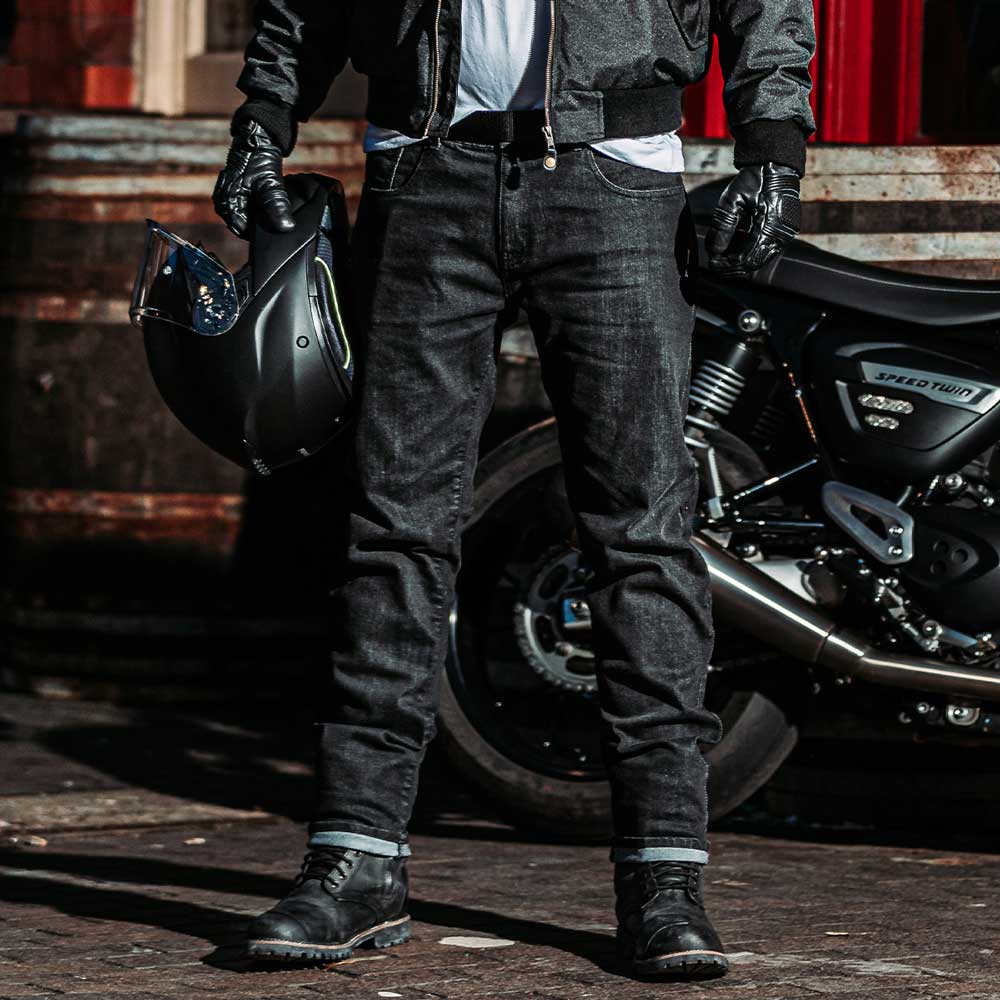 biker wearing black motorcycle jeans with black motorcycle gear for men