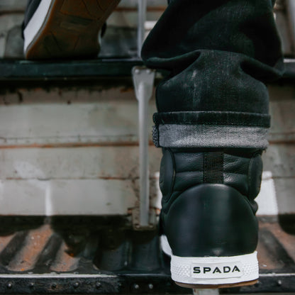 back of black motorcycle boots worn by biker