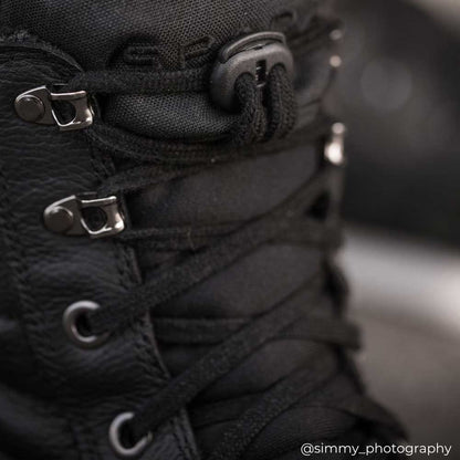 closeup of laces and closure of black motorcycle boots