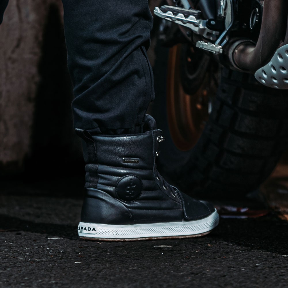 back of biker wearing black waterproof motorcycle leather trainers