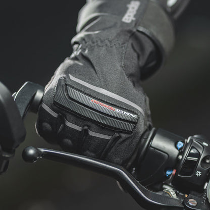 biker wearing black textile waterproof gloves on a motorbike ride