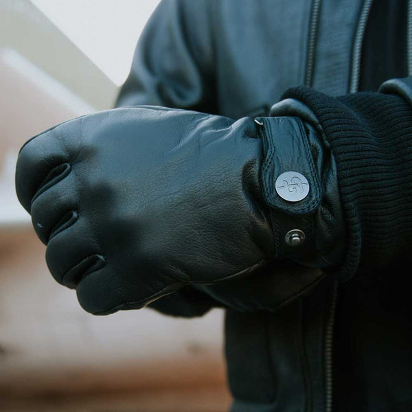 biker wearing black leather gloves with knuckle protection