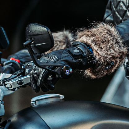 woman biker wearing black leather motorcycle gloves on a motorbike ride