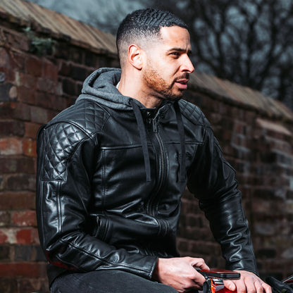 man wearing black leather motorcycle jacket with a quilted design on shoulders