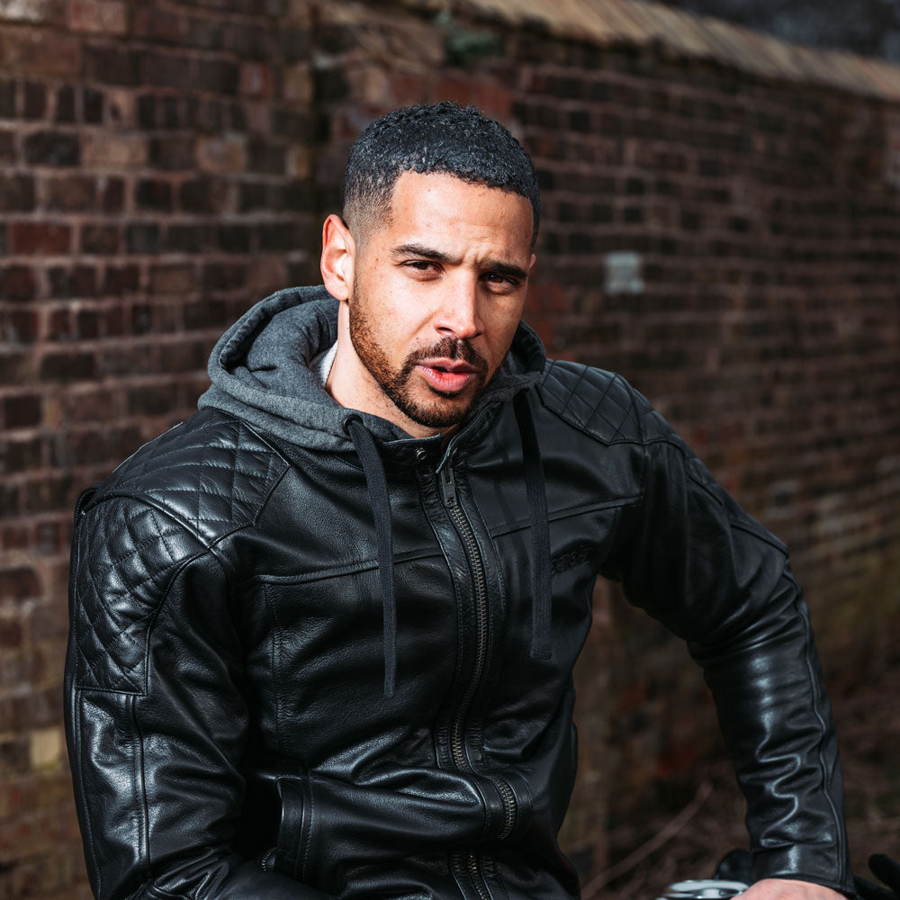 biker wearing black leather motorcycle jacket with shoulder stitching design