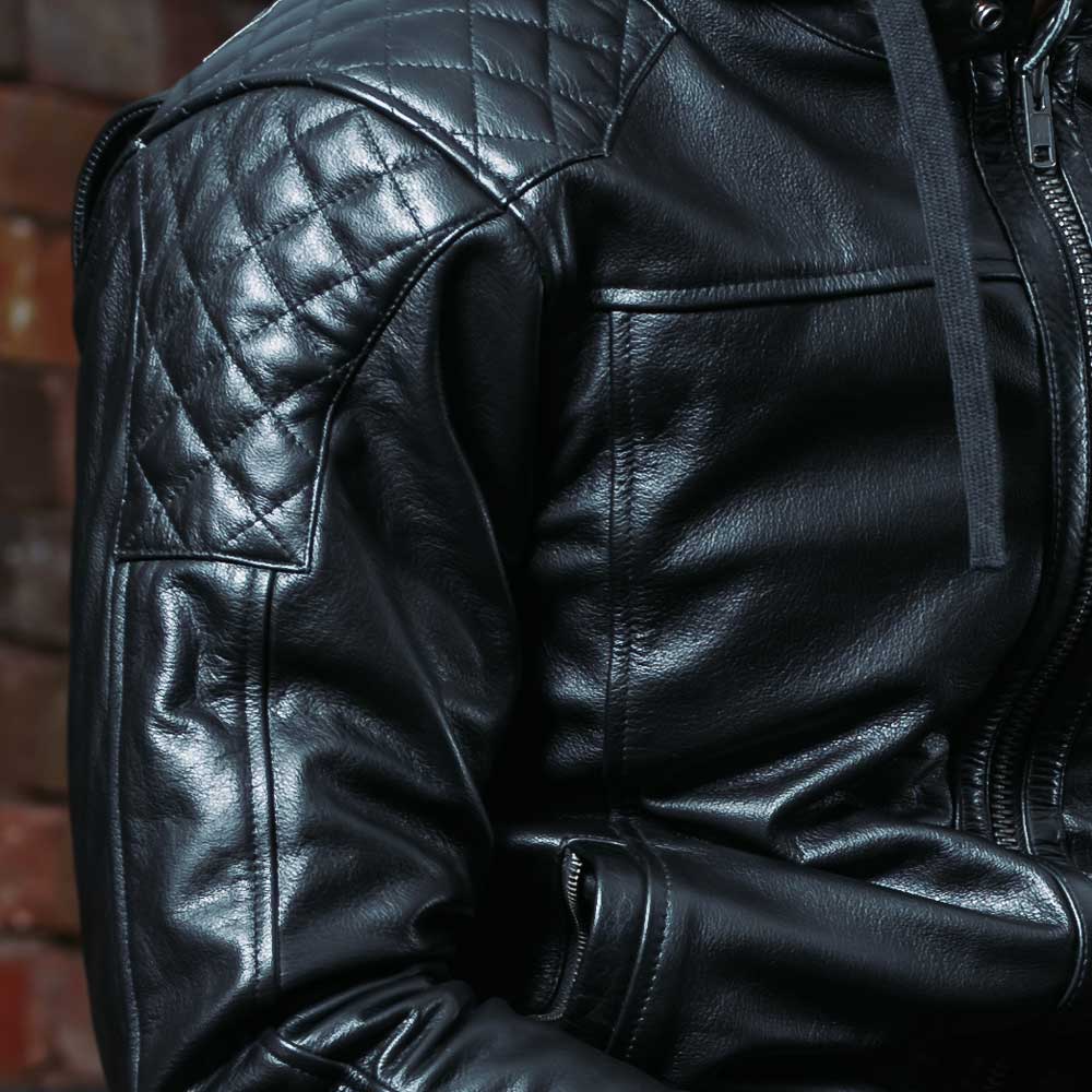 close up of quilted design on black leather jacket for men