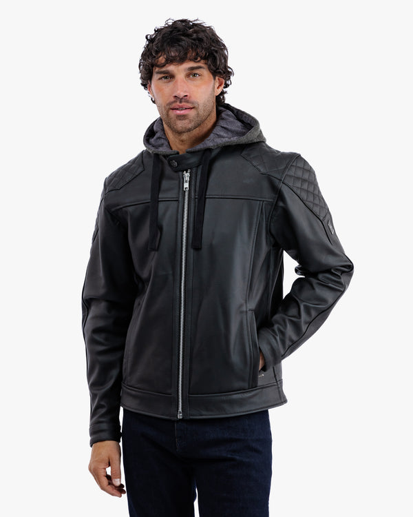 Man wearing a black leather jacket with quilted shoulder design on a white background