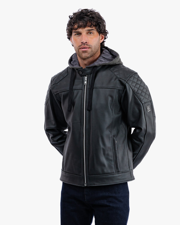 Man wearing a black quilted jacket on a white background