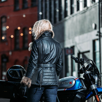 back of biker girl wearing black leather motorcycle jacket with faux fur