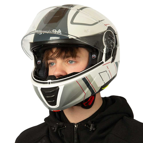 white black and grey motorbike helmet with clear visor side view