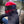 biker wearing red flip up helmet with smoked visor and black motorbike hoodie for men
