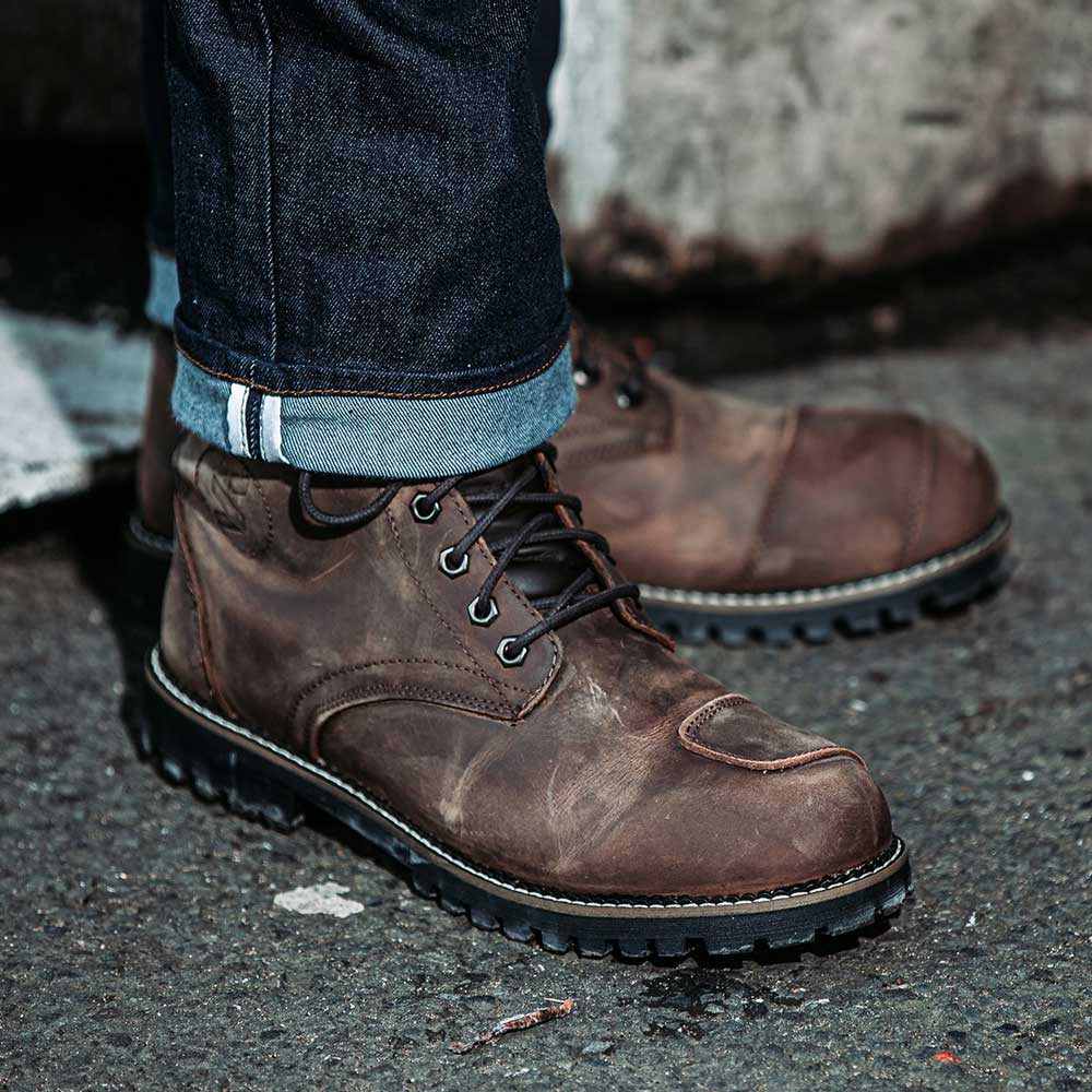 biker wearing brown distressed motorcycle boots for men