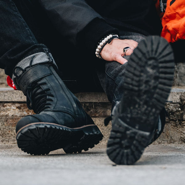 biker wearing a pair of black distressed motorbike boots