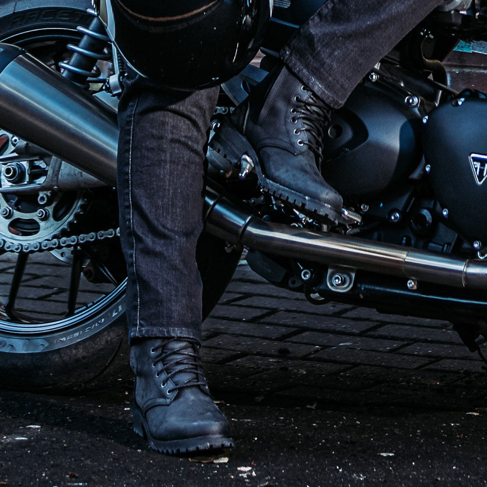 biker wearing black wax treated leather motorcycle boots