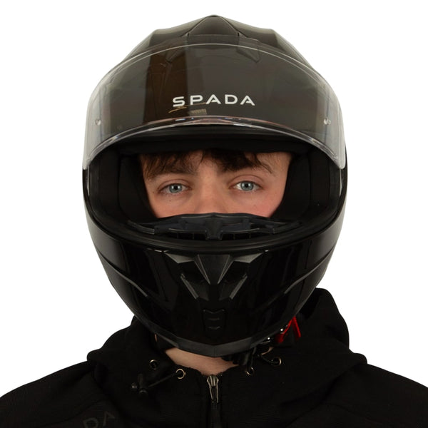 front of biker wearing black motorbike helmet with clear visor