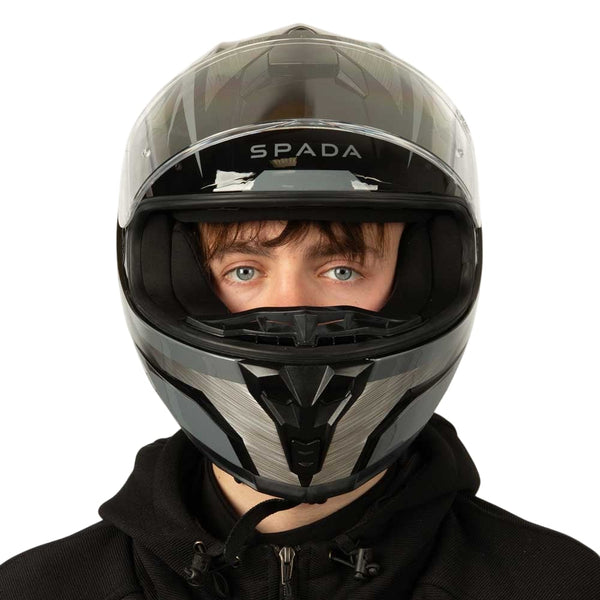 front of black and grey motorbike helmet with clear visor lifted up