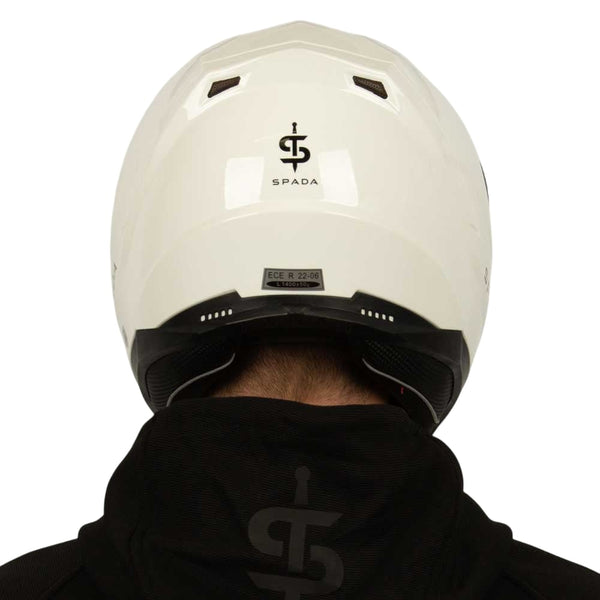 back of white motorbike helmet with black vents and rim