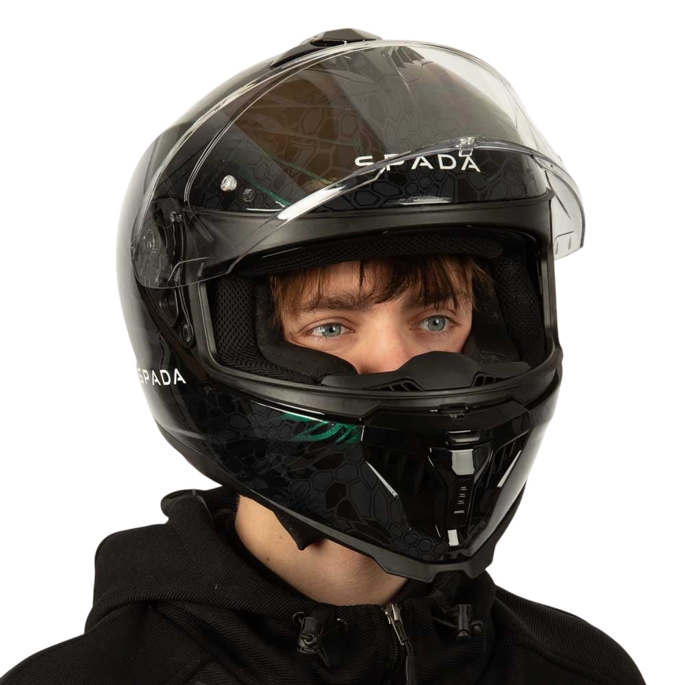 side view of black motorbike helmet with green detailing