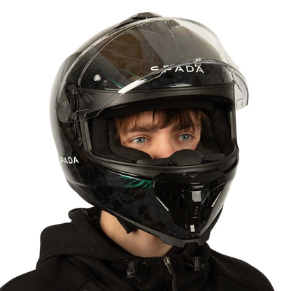 side view of black motorbike helmet with green detailing