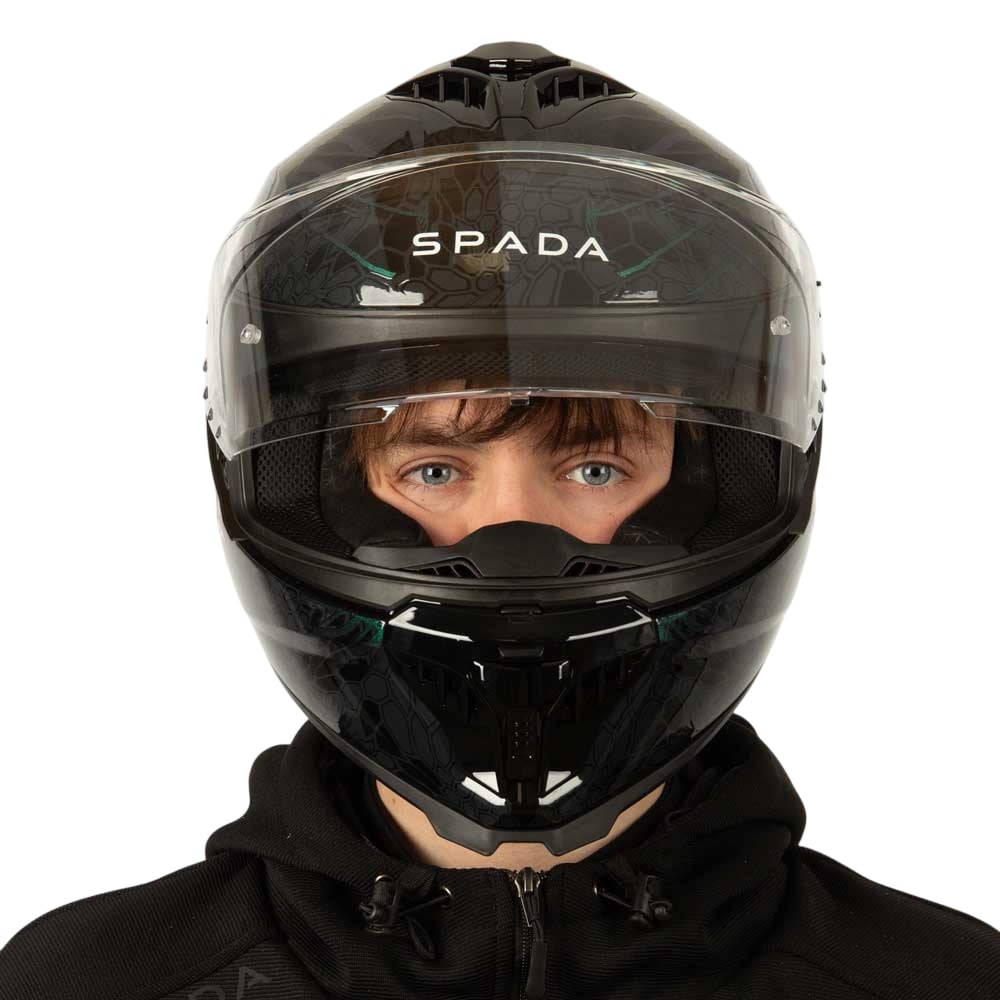 front of black and green motorcycle helmet with clear visor lifted up