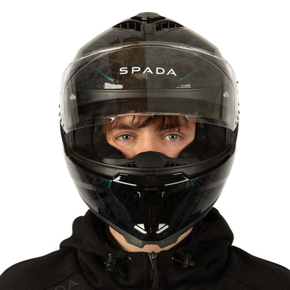 front of black and green motorcycle helmet with clear visor lifted up