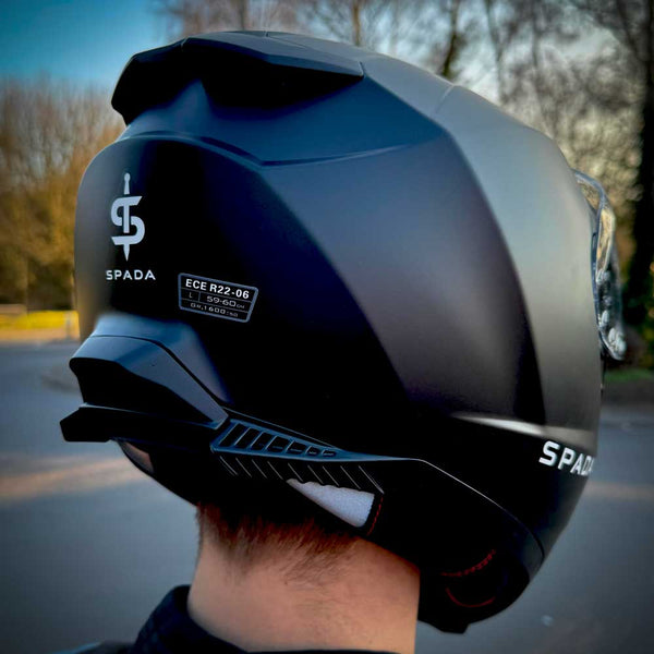 back of biker wearing matte black helmet for men