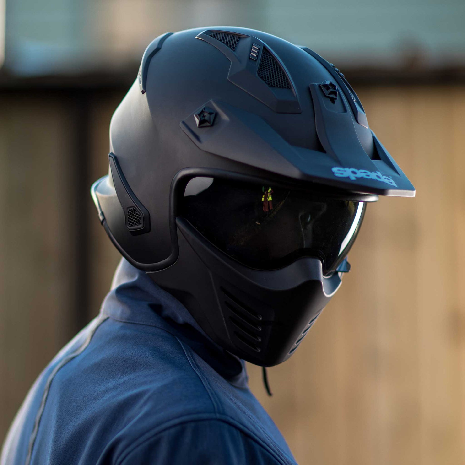 open face motorcycle helmet in matte black with drop down tinted visor and detachable chin bar
