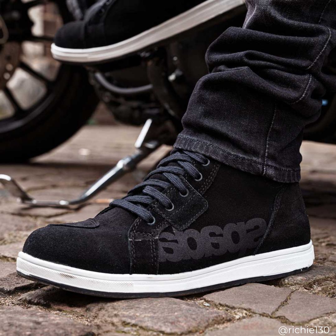 biker wearing black motorcycle trainers with black motorcycle jeans on motorbike