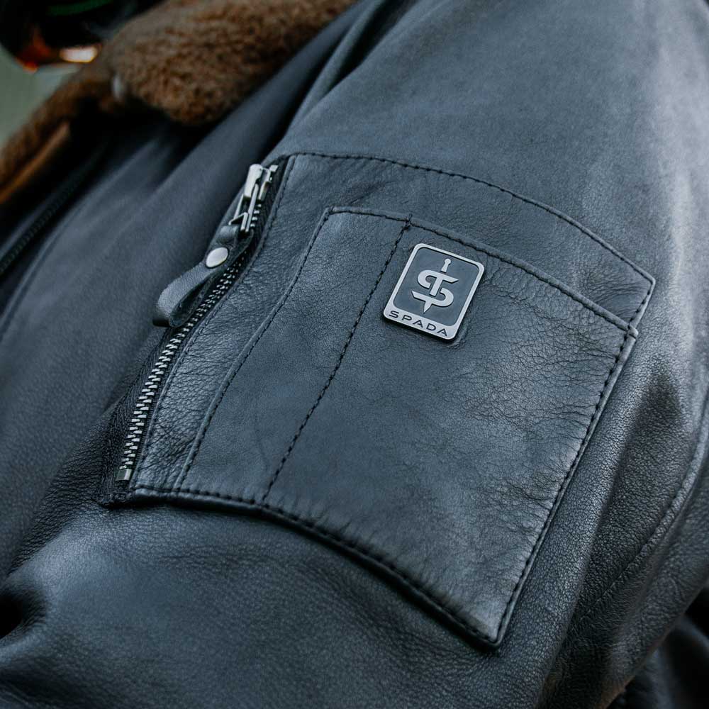 close up of sleeve details ands storage zip pocket of black leather motorcycle jacket for men